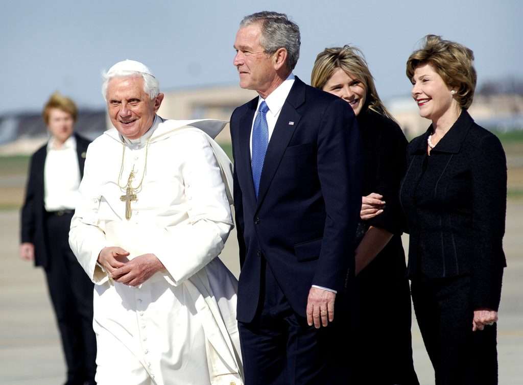 George W. Bush and Dead Pope agree innocent Iraq War victims have moved on. 