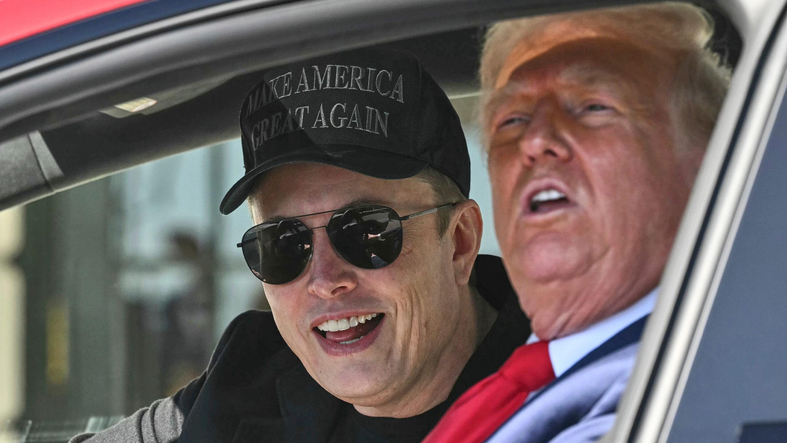Elon Musk and Trump inside Red Tesla